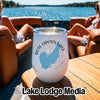 A white wine tumbler with a Rose Canyon Lake map graphic sits on a wooden boat table.