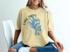 Yellow t-shirt with blue Lake Tapps Washington graphic and compass detail.