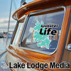 Turquoise lake outline sticker with "Webster Life" text on boat window, "Lake Lodge Media" text below.
