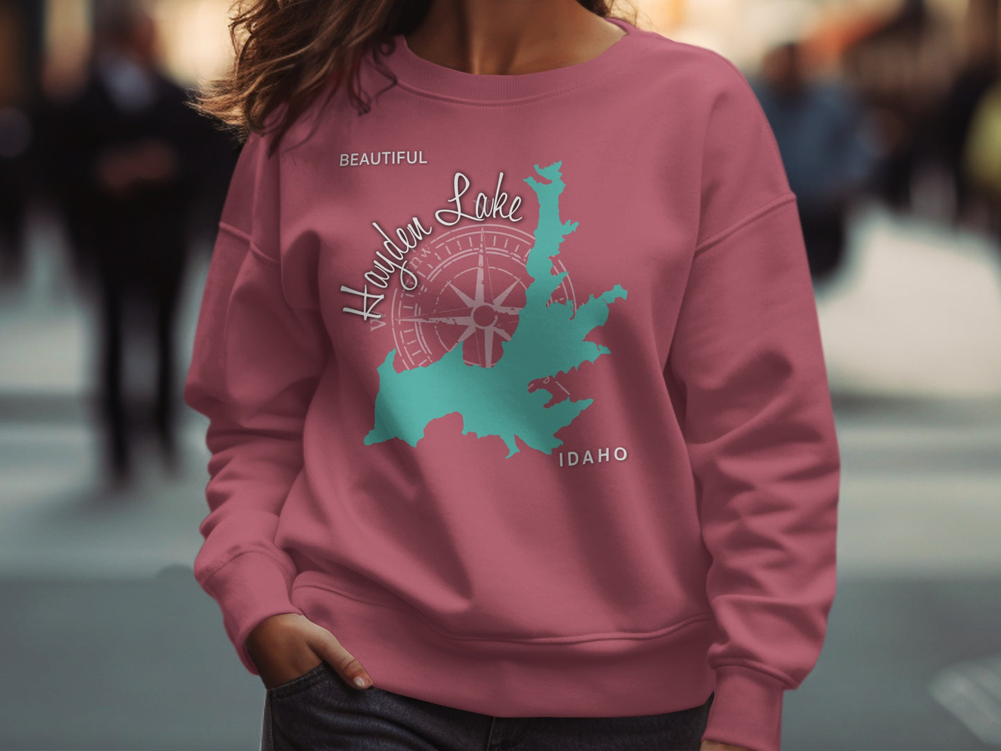 Pink sweatshirt with Hayden Lake Idaho map and compass design.