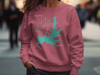 Pink sweatshirt with Hayden Lake Idaho map and compass design.