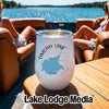 A white stainless steel wine tumbler sits on a boat table, featuring a graphic of Timothy Lake, Oregon.