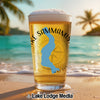 Pint glass of beer with "Lake Sammamish" text and Washington outline on beach.