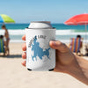 White can cooler with Shaver Lake California graphic held by hand on a beach.