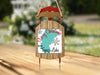 Sled ornament with "Merry Christmas" and "From Topaz Lake" text.