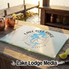 A glass cutting board featuring a Lake Blue Ridge, Georgia map and compass design on a dock bar.