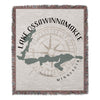 Lake Ossawinnamakee Minnesota map with compass on a fringed woven blanket.