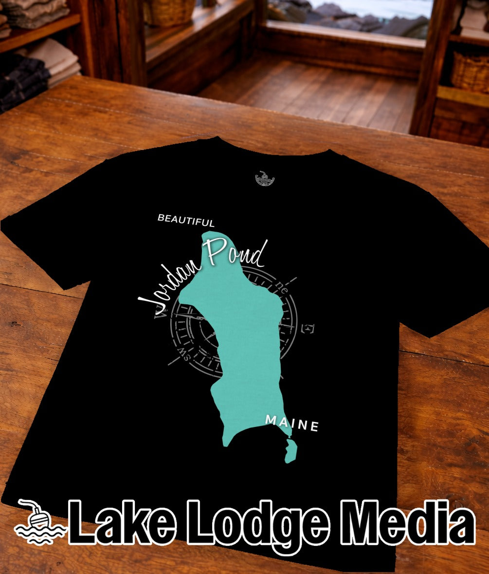 Black t-shirt with teal map of Jordan Pond and compass rose, "Lake Lodge Media" logo.