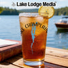 Glass of iced tea with "Lake Champlain" and compass graphic, lake background