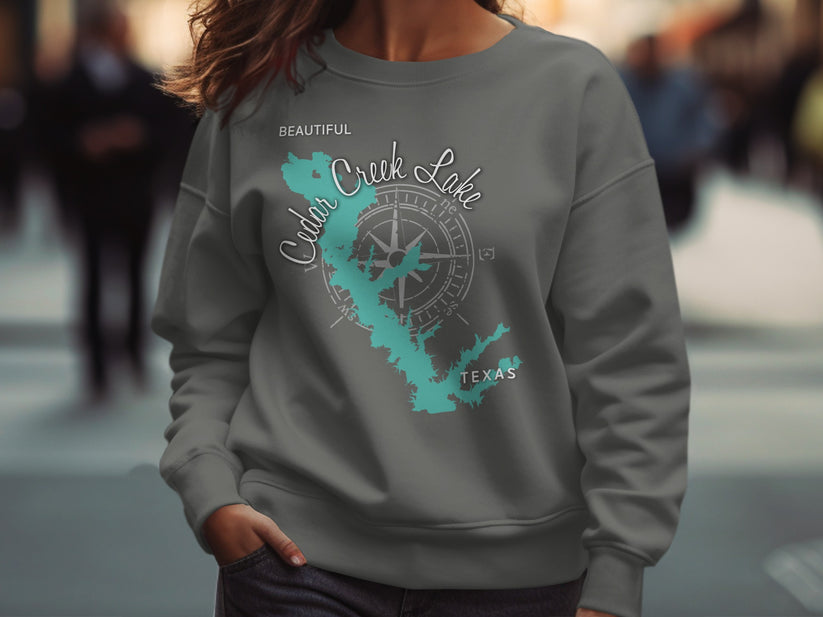 Gray sweatshirt with "Cedar Creek Lake" and compass design.