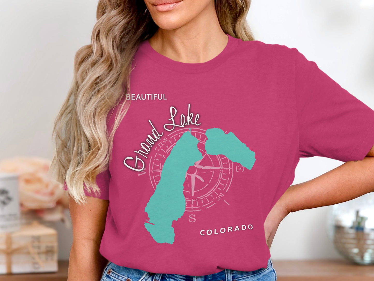 Teal Grand Lake Colorado compass graphic on a pink t-shirt.