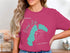 Teal Grand Lake Colorado compass graphic on a pink t-shirt.