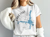 White t-shirt with blue Lake Lure map, compass, and text.