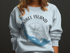 Light blue sweatshirt with "Sanibel Island Florida" and compass design.