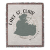 Woven blanket with Lake St. Clair map and compass design, "MICHIGAN" text.