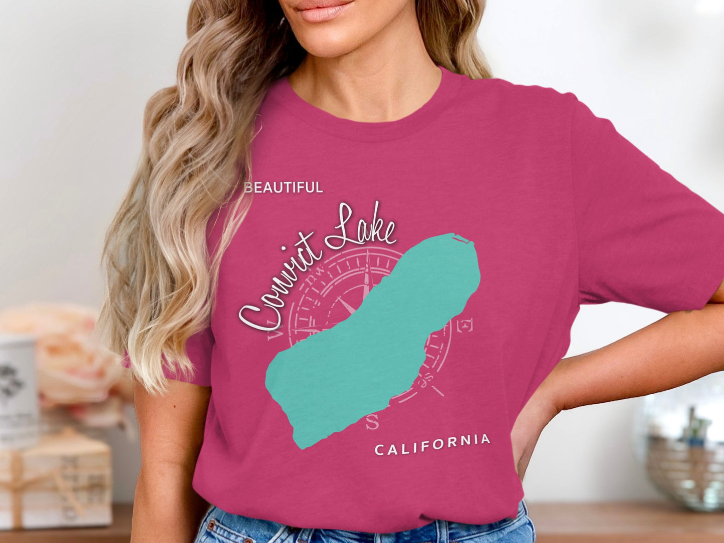 Pink t-shirt with a teal outline map of the Cowichan Lake.