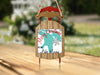 Sled ornament with "Merry Christmas From Lake Huron" and snowflakes.