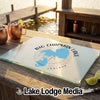 A glass cutting board featuring a blue map of Big Chapman Lake, Indiana, with a compass design.