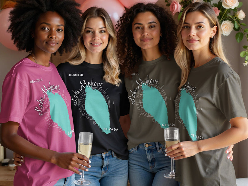 Four women in t-shirts with a Lake Mohave, Nevada graphic and compass rose design.