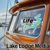Turquoise lake map sticker with "Springfield Life" text on a boat window.