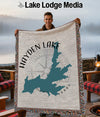 Hayden Lake Idaho map woven throw blanket with a compass graphic.