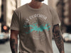 T-shirt with a turquoise Lake Ouachita map graphic and compass on taupe fabric.