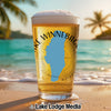 Pint glass with Lake Winnebago, Wisconsin graphic on beach with palm trees.