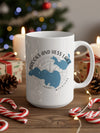 White mug with "Brooks and Hess Lake Michigan" design includes compass and lake maps.