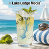 Glass with Lake Keowee map, limes, mint, and ice on beach background.
