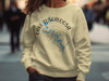 Yellow sweatshirt with Lake Tuscaloosa, Alabama map and compass design.