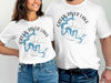 White t-shirts featuring a compass rose design with "Green River Lake Kentucky" text.