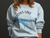 Fellows Lake Missouri design with compass rose on a light blue sweatshirt.
