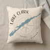 Cream pillow with "Lake Clark Alaska" text, map outline, and compass design.