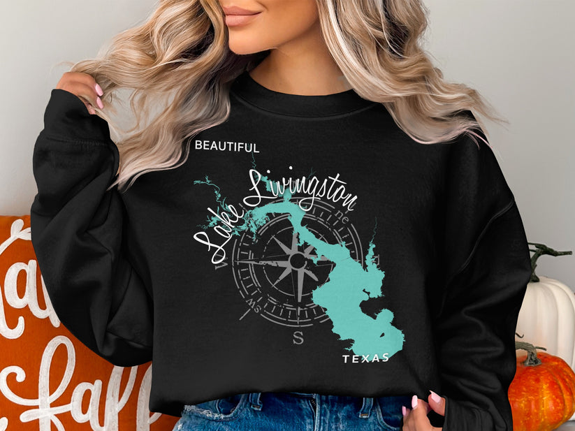 Black sweatshirt with a teal Lake Livingston map and compass rose design.