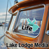 Whiskeytown Life sticker on boat window with Lake Lodge Media logo.