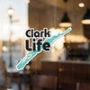 Clark Life sticker with turquoise lake shape and copyright text.