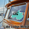 Mint green decal on boat window with "mendot Life" and "Lake Lodge Media" text.