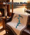 Lake Lyman South Carolina map and compass design woven blanket on leather couch.