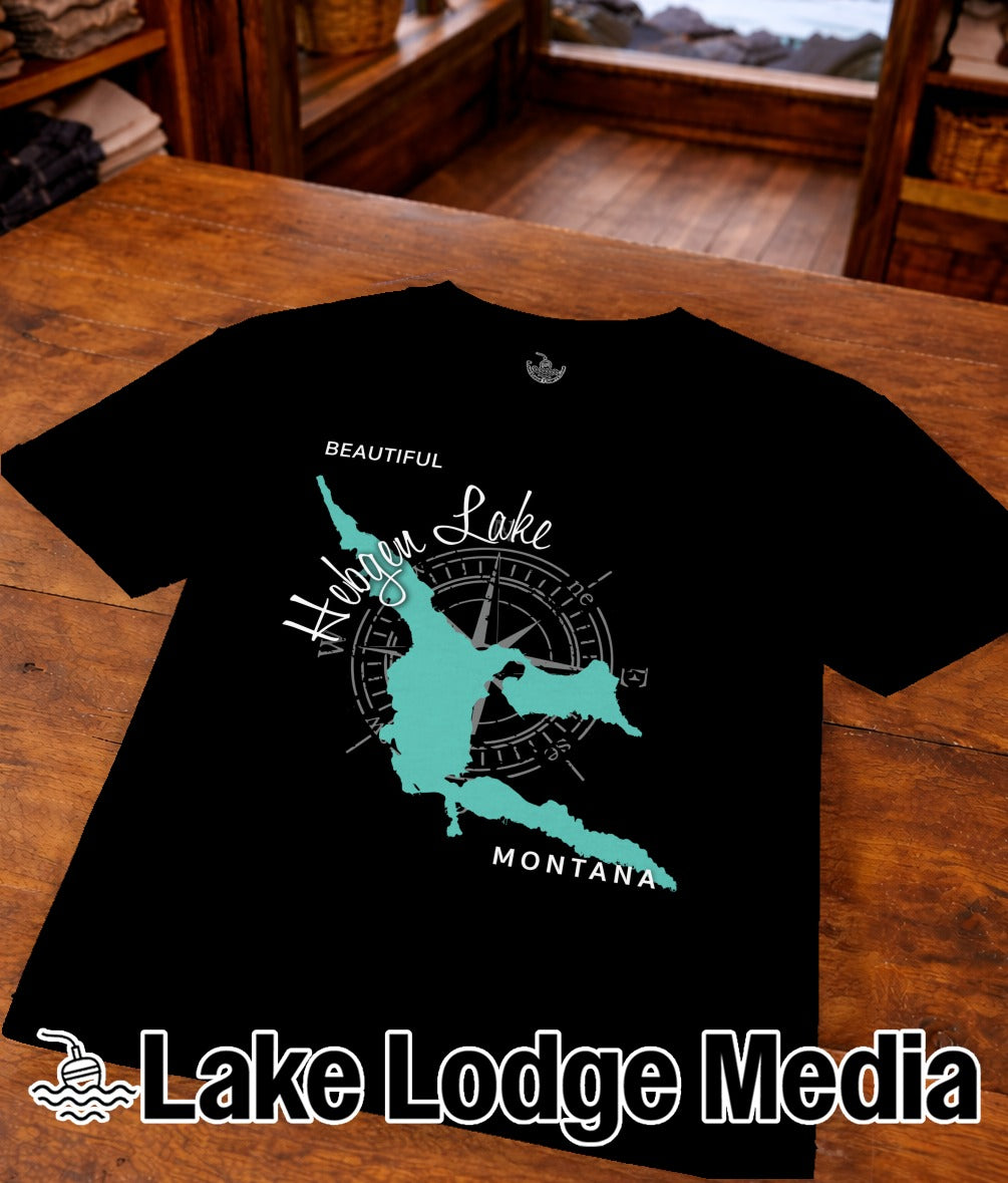 Black t-shirt with turquoise outline of a lake and compass, "Beautiful Hidden Lake Montana".