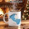 White mug with Sylvan Lake, South Dakota map design on wooden table.