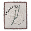 Woven blanket with "Keuka Lake" text, compass rose, and New York.