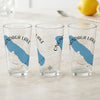 Three clear glasses featuring a blue map outline of Onondaga Lake and compass rose design.