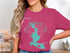 Mooselookmeguntic Lake Maine map and compass design on pink t-shirt.