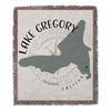 Woven blanket with Lake Gregory map outline, compass, and text.