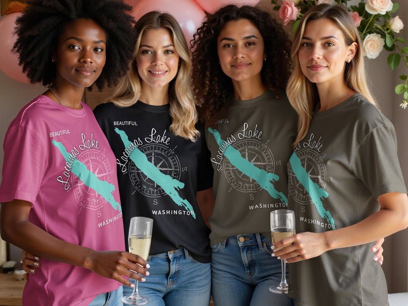 Four women in t-shirts with compass rose and "Lacamas Lake, Washington" design.