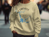 Yellow sweatshirt with Lake Oroville California map and compass design.