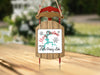 Sled ornament with "Merry Christmas from Little Grassy Lake" and snowflakes.
