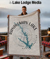 Blanket with Randleman Lake map and compass design.