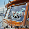 Raystown Life sticker on a wooden boat window with Lake Lodge Media logo.
