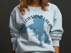 Light blue sweatshirt with Yellowstone Lake map and compass graphic.